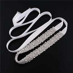 80% Rhinestone + 20% Ribbon Wedding Dress Sash Belt Is Made With Crystal Rhinestone, Clear Glass,Bead,Simple Designs,Beautiful Patterns And Sparkle! Product Dimension - Rhinestone Size:Approx. 45cm*2.5cm/17.72"*0.98"(L*W);Ribbon Size:Approx 270cm*2cm/106.3"*0.79"(L*W) Bridal Belt Adopts Hand Sewing Technology, Specially Built For Wedding Accessories. Wedding Belt For Bride Dress Can Enhance Elegance And Brilliance. Elegant Fitted Bridal Accessories With Rhinestones, White Crystal Bridal Belt For Party, White Rhinestone Bridal Belt For Evening, Evening White Bridal Belt With Rhinestones, White Rhinestone Bridal Belt For Party, White Bridal Belt With Rhinestones For Party, White Rhinestones Bridesmaid Bridal Accessories, Fitted White Crystal Bridal Accessories, Ribbon Wedding Dress