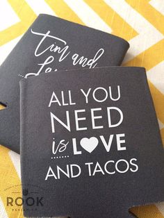 two black coasters with white writing on them that say, i am and to all you need is love and tacos