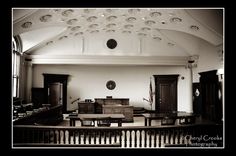 the inside of a church with pews and tables in black and white photo,