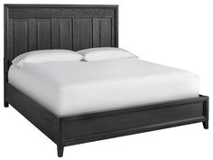 a black bed with white sheets and pillows