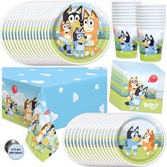 an assortment of party supplies including plates, napkins and cups with cartoon dogs on them