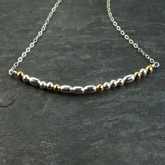 Share a secret message with a loved one. This morse code necklace is a sentimental gift perfect for that special someone that loves unique gifts. The necklace pictured, spells "LOVE" but a name or any word can be used in this necklace. Details - The necklace is 16 inches and includes an extra 2 inch extender. - Gold filled beads separate each letter in the morse code message. - Choose from words with up to 8 letters. Materials - Sterling silver flat cable chain - Sterling silver components - Ste Spiritual Silver Necklaces For Friendship, Minimalist Silver Necklaces For Friendship, Minimalist Silver Necklace For Friendship, Spiritual Necklace With Satellite Chain Gift, Spells Love, St Michael Pendant, Morse Code Necklace, Silver Gold Necklace, Anniversary Gift For Wife