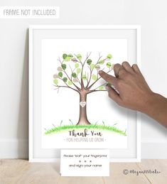 a hand holding up a card with a tree on it and the words thank you for helping us grow