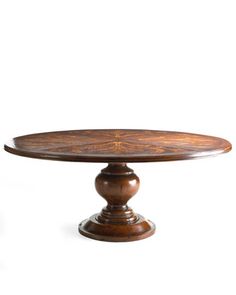 an oval wooden table with two pedestals on each side, and a circular wood top