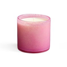 a pink candle sitting on top of a white table