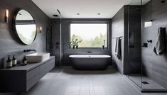 a bathroom with a tub, sink and large round mirror on the wall above it