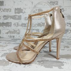 New Sidra Strappy Sandal In Champagne Sparking Crystals And A Metallic Sheen Make A Bold Statement On This Strappy Sandal Lifted By A Stiletto Heel. 4" Heel Synthetic Upper, Lining And Sole Imported Elegant Open Toe T-strap Sandals, Elegant Synthetic T-strap Sandals For Party, Evening Synthetic T-strap Sandals, Evening T-strap Sandals With Ankle Strap, Evening T-strap Ankle Strap Sandals, Evening Ankle Strap T-strap Sandals, Synthetic T-strap Sandals For Evening, Party Sandals With Cushioned Footbed And Round Toe, Elegant T-strap Synthetic Sandals