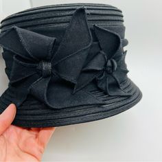 This 100% Polyester Hat With Bow Details Has Never Been Worn And Is Great For Church, A Night Out, And To Keep The Sun Off Of One’s Face. I Am Consolidating And Have So Many Gorgeous Hats And Will Be Selling Them To Make Room. Adjustable Black Cloche Hat For Summer, Fitted Black Cloche Hat Casual Style, Black Casual Cloche Hat, Black Fitted Cloche Hat Casual, Black Fitted Cloche Hat Casual Style, Fitted Black Casual Cloche Hat, Black Cloche Hat For Beach In Spring, Black Short Brim Cloche Hat For Summer, Black One Size Cloche Hat For Beach