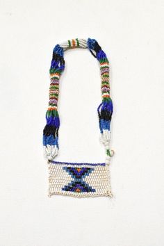 This is a beautiful Vintage Girls Love Letter Necklace from the Zulu tribe of South Africa. These kinds of Zulu love letters were made by young girls and women to express their emotions to their partners. The women made beads as gifts for friends or for admirers who had a leadership in their community such as chieftain and for daughters-in-laws. The bead work would be produced to show a sign of acceptance, welcome and building a mother-daughter relationship when their sons take a wife A very uni Art Perle, Mother Daughter Relationships, Beaded Art, Wear Necklaces, African Beads, Letter Beads, Zulu, Love Letter, Letter Necklace