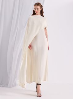 WF ATELIER Off White Two-piece Dress and Cape, you can style separately with different outfıt Model height: 177 CM 100% Viscose Length: 137 cm Cape Long sıde :145 cm Pre-draped Cape Evening Dress, Elegant Dress With Cape Sleeves, Chic Evening Dresses With Cape Sleeves, Chic Cape Dress For Formal Occasions, Cream Pre-draped Evening Dress, Formal A-line Dress With Draped Sleeves, Chic Cape Dresses For Spring, Spring Formal Dress With Cape Sleeves, Formal Fitted Cape Dress