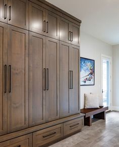 a large wooden cabinet with drawers in a living room