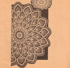 an old crochet doily pattern with a flower on it's side