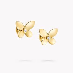 With the stylish Mini Butterfly Stud Earrings, Graff revisits one of its most treasured motifs. Freshly interpreted in 18 carat yellow gold, the butterfly’s gleaming wings are delicately angled, introducing a beautiful sense of volume, with a Graff diamond set between. Finessed by our master craftsmen to reflect the light from its polished wings, these enchanting golden butterflies displays the strong, clean edges that are a signature of every Graff jewel. At Graff we experiment with settings th Elegant Butterfly Earrings For Formal Occasions, Elegant White Gold Earrings With Butterfly Charm, Luxury Yellow Gold Butterfly Earrings, Formal Butterfly Diamond Earrings, Luxury Gold Butterfly Earrings, Elegant Gold Butterfly Earrings, Elegant Gold Butterfly-shaped Earrings, Gold Earrings With Butterfly Charm For Formal Events, Gold Earrings With Butterfly Charm For Formal Occasion