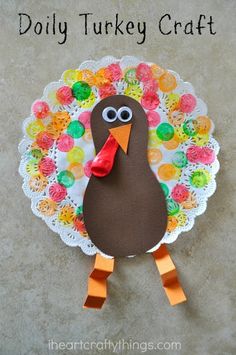 a turkey craft made out of paper and yarn with the words dolly turkey craft on it