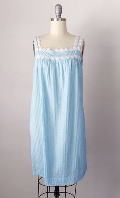 "Gorgeous 1970s Mexican style lounge dress and robe! Perfect for lounging around the house; also so cute worn out as a sundress/duster together or as separates! The robe would also be cute worn buttoned as a tunic top with shorts under. So many options! ~Blue cotton Mexican style set with crochet trim ~Nightgown is slip on style ~Button down matching robe Brand: none Hand washed and ready to wear. Condition: Excellent. Just a small mark on lace near hem. Size: Fits like a modern XS/S *please con Summer Lace Patchwork Sleepwear, Cottagecore Lace Trim Nightgown For Loungewear, Cottagecore Nightgown With Lace Trim For Loungewear, Cottagecore Lace Trim Sleepwear For Home, Cottagecore Sleepwear With Lace Trim For Home, Cottagecore Sleepwear With Lace Trim, Cottagecore Summer Nightgown For Home, Cottagecore Summer Nightgown, Spring Lace Patchwork Nightgown For Loungewear