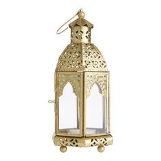 Cast a warm glow in your room with our beautifully handcrafted Latika candle lantern from India. Made of glass and metal with an antiquegold finish, this exquisite, petite lantern has a hinged door for easy access to the interior. We recommend grouping multiple lanterns together on or above a buffet or accent table for a sublime boho take on Moroccan-style decor. Boho Lanterns, Hanging Candle Lanterns, Lantern Craft, Gold Lanterns, Hanging Candles, Candle Lantern, Gold Candles, Outdoor Lanterns, Lantern Candle Holders