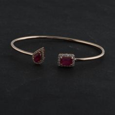 Ruby Bracelet, 18k/14Kt Gold Ruby Bangle, July Birthstone Bracelet, Halo Open Bangle, Open Cuff Bracelet,Ruby Bezel Bracelet,Flexible Bangle Details :- Item Code:- SEB-6021B Gross Weight :- 5.89 gm 18k White Gold Weight :- 5.42 gm Diamond Weight :- 0.36 ct. (Si Clarity Hi Color Certified Diamonds) Ruby Weight :-1.97 ct. Size : 5.62 X 8.06 mm ≫ FAQ below for more detail. ✦ Sizing We can adjust most items to fit your sizing preferences. Most items can be made to any size and length. Please leave a Luxury Yellow Gold Cuff Bracelet With Gemstone, Luxury Gemstone Cuff Bracelet For Anniversary, Fine Jewelry Gemstone Cuff Bracelet For Formal Occasions, Formal Fine Jewelry Cuff Bracelet With Gemstone, Formal Gemstone Cuff Bracelet, Formal Gemstone Cuff Bracelet In Bangle Shape, Formal Gemstone Bangle Cuff Bracelet, Formal Yellow Gold Cuff Bracelet With Gemstone, Formal Fusion Bangle Bracelets