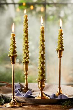 three candles are sitting on a table