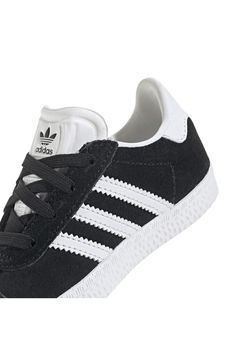 Initially designed in '91 as a training shoe for top athletes, the iconic Gazelle sneaker has been refreshed with stretchy laces for your little athlete. Pull-on style with elastic laces Leather and synthetic upper/textile lining/rubber sole Imported Casual Lace-up Skate Shoes For Training, Sports High-top Sneakers With Elastic Laces And White Sole, Athleisure Low-top Sneakers With White Laces, Low-top Athleisure Sneakers With White Laces, Sporty Synthetic Skate Shoes With Elastic Laces, Sporty Synthetic High-top Sneakers With Elastic Laces, Synthetic Skate Shoes With Elastic Laces For Sports, High-top Skate Shoes With Elastic Laces, Elastic Lace High-top Sneakers For Jogging