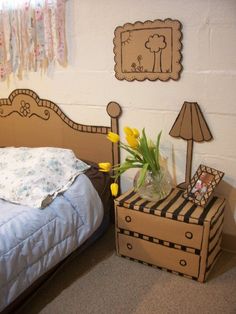 a bedroom with a bed, nightstands and pictures on the wall next to it