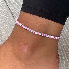 🌸 White and baby pink miracle bead anklet 🌸  ♥️Catches the light to give off a glow!  ♥️Perfect for nights out or even holidays!  ♥️Please message me if you have any questions each  ♥️ All anklets are made on rope. The two ends will need to be tied together and in a double knot so that the anklet does not come off. These are safe to wear in water.  Also available with matching bracelets, earrings and chokers! The colour may vary slightly due to most images being taken under direct sunlight or with flash to show you the full effect of the beads x  White beads may appear grey/silver when opened in a dark room. The full effect of the beads will shine through in different lights. Please note: Buyer pays for any return postage/ exchange postage x Cheap Pink Round Bead Anklets, Pink Tiny Beads Anklets For Summer, Pink Beaded Anklets For Summer, Pink Anklets With Tiny Beads For Summer, Pink Beaded Summer Anklets, Casual Pink Anklets For Summer, Casual Pink Anklet For Summer, Summer Pink Anklet With Colorful Beads, Casual Pink Handmade Anklet