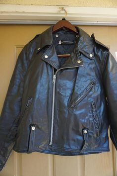 Vintage  70s Size 42 Large mens black leather Harley Davidson biker/motorcycle jacket. Great condition - see photos -missing belt  Features All measurements taken across front while lying flatSleeves 26"Shoulders 19"Chest 23" across front armpit to armpit3 zip outside pockets Length 25"full  lining w/1 inside pocket Label Harley Davidson Black Rockabilly Biker Jacket For Biker Events, Black Retro Biker Jacket For Motorcycling, Vintage Black Leather Jacket For Biker Events, Vintage Black Biker Jacket For Biker Events, Vintage Black Biker Jacket, Vintage Halter Dress, Harley Davidson Vintage, Bathing Suit Dress, Bathing Suit Covers