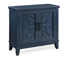 a blue cabinet with two doors on the front and one door open to reveal an intricate design