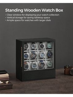 a watch box with twelve watches in it on a table next to books and a camera