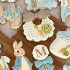 baby shower cookies are arranged on a cutting board with the word'n'm '