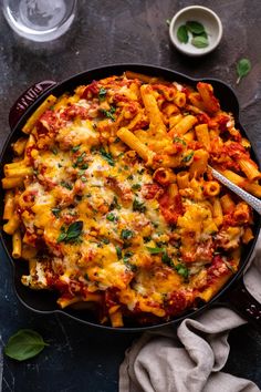 a skillet filled with pasta and sauce