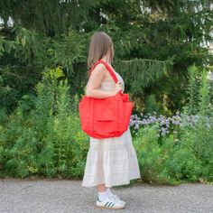 A travel bag optimized for flying: it fits under an airplane seat, on top of your roller bag, and on your shoulder. Exterior pockets keep your travel essentials within reach, including a tech pocket that fits up to a 16” laptop, and side pockets for your water bottle and boarding pass. The bag packs down into its interior detachable pouch for easy storage. If there's one thing we all agree on at Golden Rule, it's that Baggu is essential. Form and function meet in this eco carry-all that works ha Baggu Carry On, Nylon Travel Bag With Pockets For On-the-go, Casual Nylon Shoulder Travel Bag, Functional Shoulder Bag Travel Accessories For Weekend Trips, Versatile Travel Tote For Trips, Functional Weekender Bag With Pockets For Weekend Trips, Casual Nylon Shoulder Bag With Luggage Sleeve, Casual Large Capacity Nylon Luggage, On-the-go Travel Backpack With Pockets