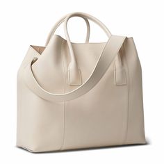 Practical and stylish, this versatile mini weekender is a perfect carry-on bag for a warm weather getaway or for times when a roomy handbag is required on a busy day. Expertly made to the highest standards in Italy, it has shoulder straps or a longer detachable strap that can be used for ease of transport. Timeless White Bag For Daily Use, Modern Cream Satchel With Large Capacity, Modern Large Capacity Cream Satchel, Elegant Weekender Satchel With Removable Pouch, Elegant Weekender Satchel Bag With Removable Pouch, Leather Weekender Bag With Dust Bag For Everyday, Elegant Weekender Bag With Removable Pouch, Elegant Weekender Bag With Removable Pouch And Double Handle, Elegant Large Capacity Weekender Bag