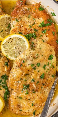 chicken with lemons and parsley in a skillet