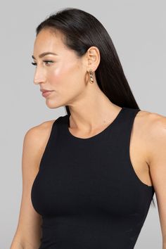 Why we love this: Bold & beautiful. With a built-in bra and a sexy halter top design, this top will make you feel effortlessly flawless no matter where you day may take you! Features: KiraGrace Luxe: Feels ultra-soft and luxurious Medium compression: Form fitting for moderate support Perfect from the studio to the streets Double-layer shelf bra for support. Need removable bra cups? Made in USA of imported fabric FIT: Form-fitting, hip-length tank that stays put COVERAGE: Halter neckline for maxi Chic Racerback Top With Built-in Bra, Chic Racerback Halter Top With Built-in Bra, Versatile Halter Top With Built-in Bra For Night Out, Chic Black Bra-friendly Tops, Sleek Black Sleeveless Halter Top, Fitted Black Tank Top With Built-in Bra, Chic Workout Tank Top With Built-in Bra, Versatile Halter Neck Tank Top With Built-in Bra, Black Halter Neck Crop Top With Built-in Bra