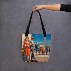 Stay stylish and organized on the go with our spacious tote bag, now with FREE SHIPPING to the US, Canada, EU, and UK! THE ARTWORK Indulge in the grace of a past epoch, immortalized in this artwork that portrays chic figures appreciating the iconic Eiffel Tower. The vibrant hues and timeless fashion evoke the enduring allure of Paris, rendering this piece an ideal acquisition for aficionados of art and admirers of The City of Light. THE TOTE BAG This tote bag is both trendy and practical and is Shopping Tote Bag With Case Included, Rectangular Bags With Artwork For Daily Use, Artistic Rectangular Shoulder Bag For Travel, Artistic Large Capacity Shoulder Bag For Travel, Artistic Shoulder Bag For Travel, Artistic Tote Shoulder Bag For Travel, Paris Tour, Paris Tour Eiffel, Unique Tote Bag