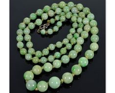 "Gorgeous apple green jadeite jade bead necklace - all original - C.1920. Finely polished graduated beads are from 3/8\" to 3/16\" diameter. The beads are strung on knotted thread with original bolt clasp. The necklace is 25\" long. Total weight is 34 grams. Spring ring clasp. Excellent antique condition." Formal Green Hand-strung Jewelry, Vintage Jade Beaded Necklace, Classic Jade Gemstone Beads Jewelry, Formal Single Strand Jade Necklace, Vintage Jade Bead Necklaces, Vintage Jade Necklaces With Round Beads, Vintage Jade Jewelry Hand-strung, Vintage Jade Jewelry With Round Beads, Vintage Hand-strung Jade Jewelry