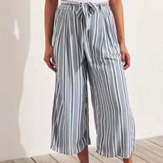 Hollister Ultra High Rise Culottes Womens S Chambray Blue Nwt Discontinued Viscose Machine Wash Crop Lightweight Non Stretch Woven Construction Back Elastic Waistband Belt Loops Tie Belt Pull On Lined Side Pockets Also Shown In Dark Navy Stripe Striped Wide-leg Summer Pants, Blue Pants For Summer Vacation, Striped Long Pants For Summer, Blue Summer Pants For Vacation, High Waist Summer Pants For Brunch, Summer Vacation Blue Pants, Summer Wide-leg Bottoms For Brunch, Striped Trousers For Summer, Striped Summer Trousers