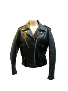 What you are looking at ia an original late 1960's to early 1970's Vintage AMF Harley Davidson Cycle Queen Womens Black Leather Motorcycle Jacket. Made by AMF Harley Davidson in the U.S.A,. This vintage leather motorcycle jacket is marked size 36 will fit a 6 or a women's size small. .  The measurements are armpit to armpit 19 inches across. The shoulder to shoulder measurements is 16 inches across. The jacket length when measured from the top of the collar down to the back to the bottom hem of Amf Harley, Vintage Leather Motorcycle Jacket, Mens Bowling Shirts, Black Leather Motorcycle Jacket, Black Leather Biker Jacket, Bowling Shirts, Leather Biker Jacket, Leather Motorcycle Jacket, Jacket Vintage