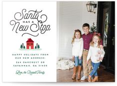 three children standing in front of a christmas card with the words santa has a new stop