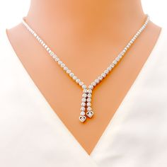 This exquisite 18k white gold necklace set, weighing 30.8 grams, features a graceful tassel design adorned with dazzling diamonds. The white gold finish enhances its elegant appeal, making it perfect for any special occasion. The set includes a necklace with a total diamond weight of 2.94 carats, featuring F-G color and VS quality diamonds in round shapes. The necklace has a length of 17 inches with a 1-inch drop length and is secured with a push lock and clasp. The matching earrings, each measu White Gold Necklace, 18k Gold Necklace, Lock Style, Gold Necklace Set, White Gold Necklaces, Quality Diamonds, Matching Earrings, Gold Finish, Diamond Shapes