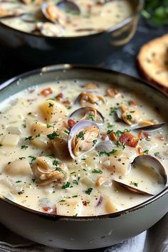 two bowls of clam chowee on a table