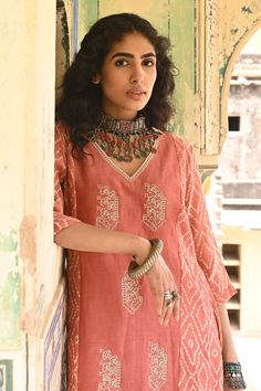 Peach chanderi kurta with block print motifs and pearl embroidery. Comes with straight pants.
Component: 2
Pattern: Print and Embroidery
Type Of Work: Block Print and Pearl
Neckline: V neck
Sleeve Type: Three Quarter
Fabric: Chanderi and Cotton Flax
Color: Peach
Other Details: 
Side slits
Occasion: Puja - Aza Fashions Print Motifs, Chanderi Kurta, Kurta Pant Set, Pearl Embroidery, Pant Set For Women, Kurta With Pants, Fashion App, Agra, Pant Set