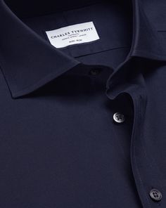 100% cotton, Available in slim and extra slim fit, Non-iron, Modern spread collar, Split yoke for optimal fit and comfort, Slim fit: back pleats for ease of movement, Extra slim fit: streamline back darts, Mitred two-button cuff or square French cuff, Complimentary brass collar stays, Machine washable - Cutaway Collar Non-Iron Twill Shirt - Navy | Men's Charles Tyrwhitt Cutaway Collar Non-Iron Twill Dress Shirt - Navy Single Cuff Blue Size Small Cotton Semi-formal Slim Fit Collared Shirt, Classic Navy Semi-formal Tops, Classic Fitted Shirt With Welt Pockets, Classic Tops With Concealed Placket For Workwear, Modern Tailored Tops With Spread Collar, Timeless Slim Fit Office Tops, Timeless Slim Fit Tops For Office, Classic Dress Shirt With Welt Pockets For Work, Tailored Solid Color Business Tops