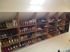 there are many pairs of shoes in the closet