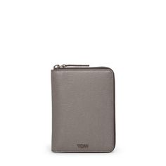 Keep your essential travel items secure with this zip-around case, featuring a designated place for your passport, as well as a bill compartment, card slots, and room for other important documents. Luxury Silver Wallet For Travel, Luxury Silver Travel Wallet, Essential Travel Items, Passport Case, Important Documents, Travel Products, Pewter Metal, Travel Items, Travel Essentials