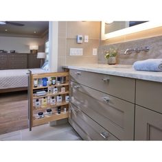 a bathroom with two sinks and drawers in it