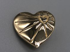 A beautiful vintage gold tone variety club heart brooch.  Approximate measurements  Length - 2.8 cm Width - 2.8 cm  * Due to this item being vintage there may be markings on the piece. Please view the video and photos to see the condition of the jewellery. Vintage Gold Heart Brooches, Gold Heart-shaped Brooch For Formal Occasions, Gold Heart Brooch For Formal Occasions, Gold Heart Brooch For Formal Wear, Vintage Gold Brooches For Valentine's Day, Gold Brooches For Valentine's Day, Gold Brooches For Formal Valentine's Day, Gold Brooches For Valentine's Day Formal, Gold Heart-shaped Brooches For Gifts