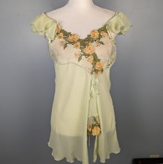 Vintage Green Ruffle Top And Short Set Marked A Size Large, I Can Provide Measurements If Needed! Rare Set By H.S. Miss Salma Beautiful Orange And Green Floral Details On The Bust Comes With The Shorts Which Are Also A Size Large No Flaws! Pretty Bows On The Shorts And Stretchy Waist Y2k Fairy If You Have Any Questions Don't Hesitate To Ask! Fitted Green Sleepwear With Lace Trim, Spring Fitted Ruffled Sleepwear, Spring Fitted Sleepwear With Ruffles, Fitted Ruffled Sleepwear For Spring, Spring Victoria's Secret Sleepwear With Ruffles, Victoria's Secret Spring Sleepwear With Ruffles, Green Ruffle Top, Green Fairy, Y2k Fairy