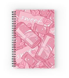 a spiral notebook with pink candy and hearts on the cover that says sweet love in white letters