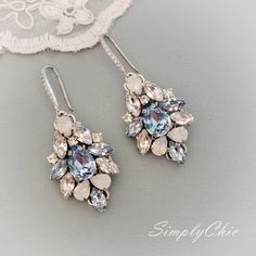 Elegant Vintage style Bridal Earrings. Made with high-quality Swarovski rhinestones in light blue and clear crystals, finished with elegant crystallized french hooks. Designed and created in SimplyChic studio Matching necklace available at this link: https://www.etsy.com/listing/782914818/sapphire-light-blue-statement?ref=shop_home_active_2&frs=1 Matching bracelet: https://www.etsy.com/listing/786999339/sapphire-light-blue-statement?ref=shop_home_active_43&pro=1&frs=1 Matching hair a Elegant Jeweled Blue Crystal Earrings, Elegant Blue Jeweled Crystal Earrings, Blue Cubic Zirconia Chandelier Earrings For Party, Light Blue Crystal Jewelry For Wedding, Light Blue Crystal Wedding Jewelry, Wedding Crystal Jeweled Chandelier Earrings, Crystal Jeweled Chandelier Earrings For Wedding, Elegant Blue Crystal Chandelier Earrings, Crystal Jeweled Bridal Earrings For Wedding